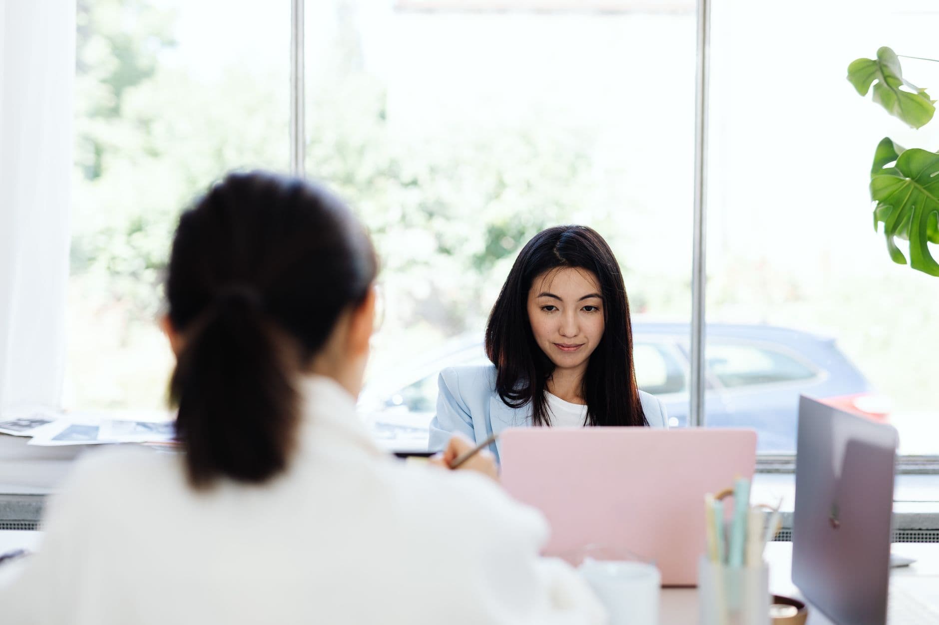 Two professionals talking across a table during a fractional CHRO interview