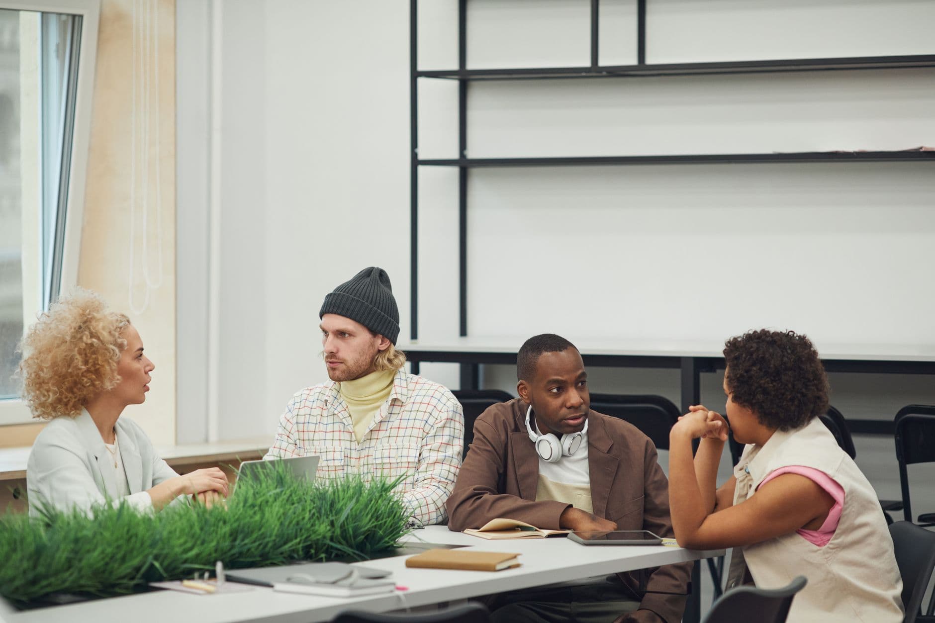 A diverse team collaborating in an open-plan office workspace